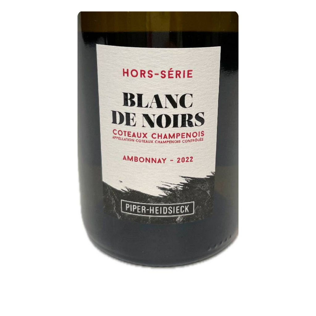 Close do rótulo texturizado do Coteaux Champenois Piper-Heidsieck, destacando o nome Ambonnay e a safra 2022.