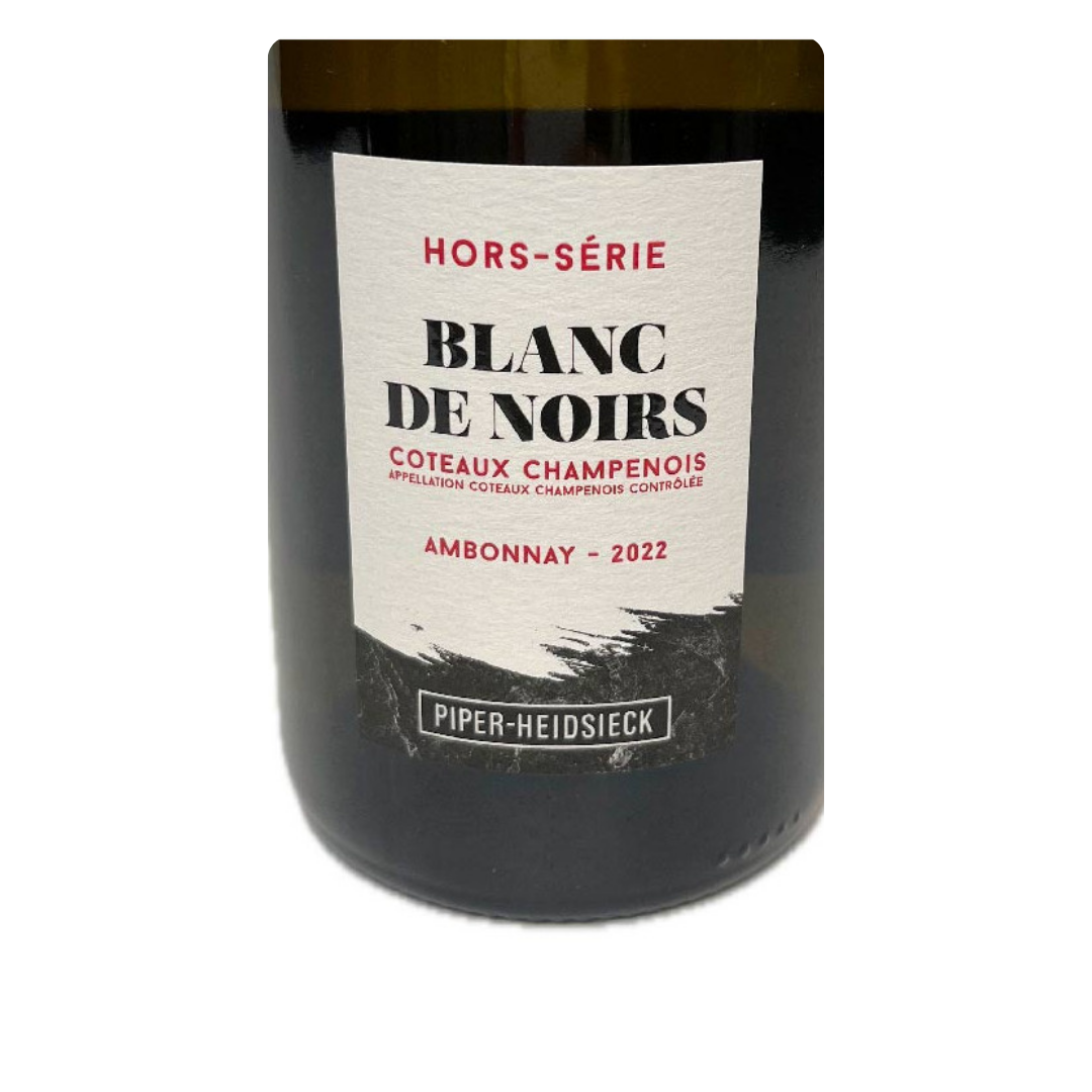 Close do rótulo texturizado do Coteaux Champenois Piper-Heidsieck, destacando o nome Ambonnay e a safra 2022.