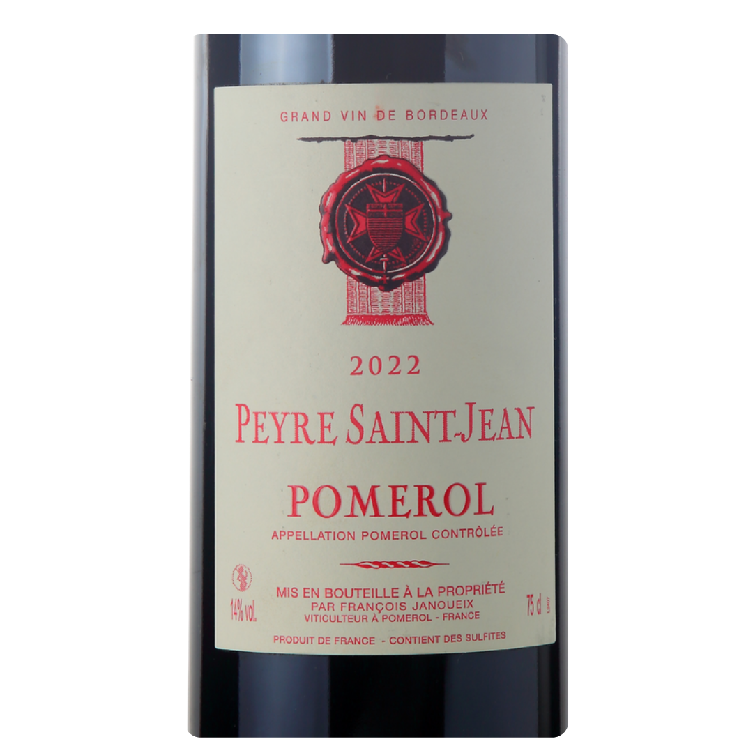Close-up do rótulo do vinho Peyre Saint-Jean 2022, exibindo o nome François Janoueix, a denominação Pomerol, Bordeaux, e a safra 2022.