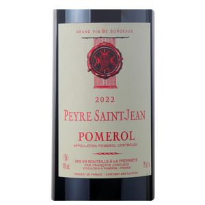 Close-up do rótulo do vinho Peyre Saint-Jean 2022, exibindo o nome François Janoueix, a denominação Pomerol, Bordeaux, e a safra 2022.